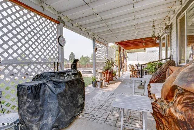 a bed sitting in a room next to a window