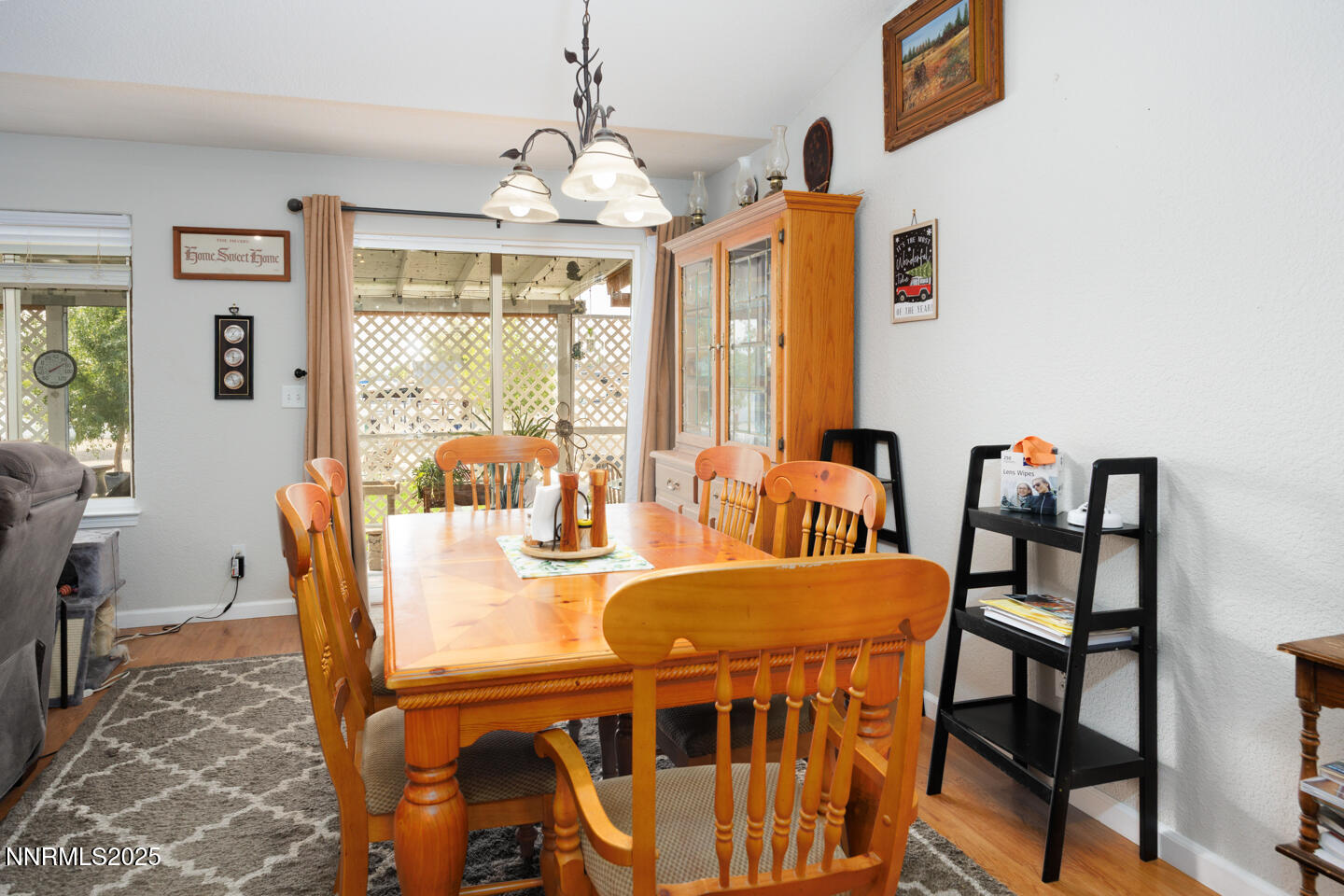 5655 Dillon Drive Fallon, NV 89406 - Photo 7 of 25 a view of a dining room with furniture a chandelier and wooden floor