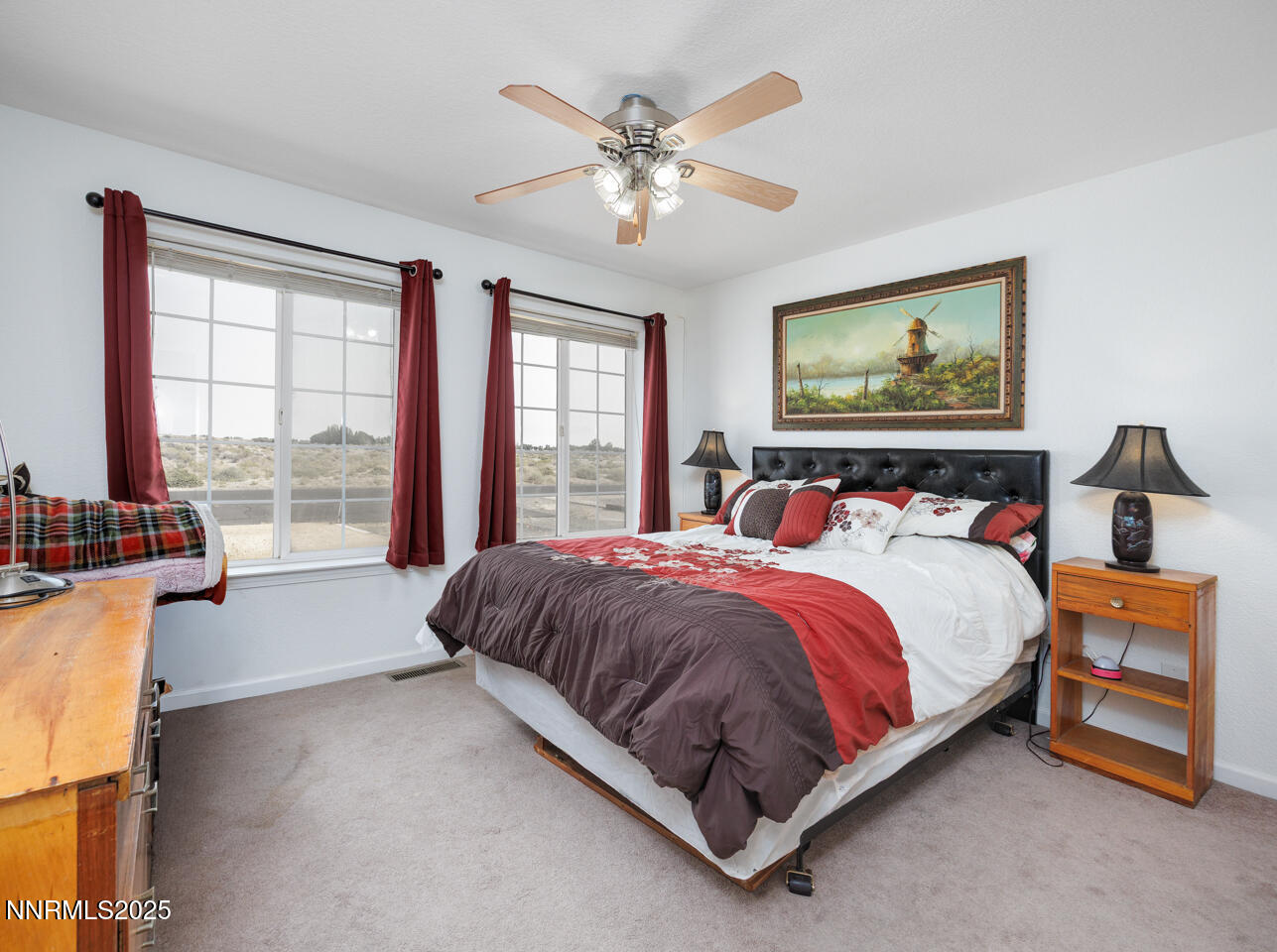 5655 Dillon Drive Fallon, NV 89406 - Photo 9 of 25 a bed sitting in a bedroom next to a window