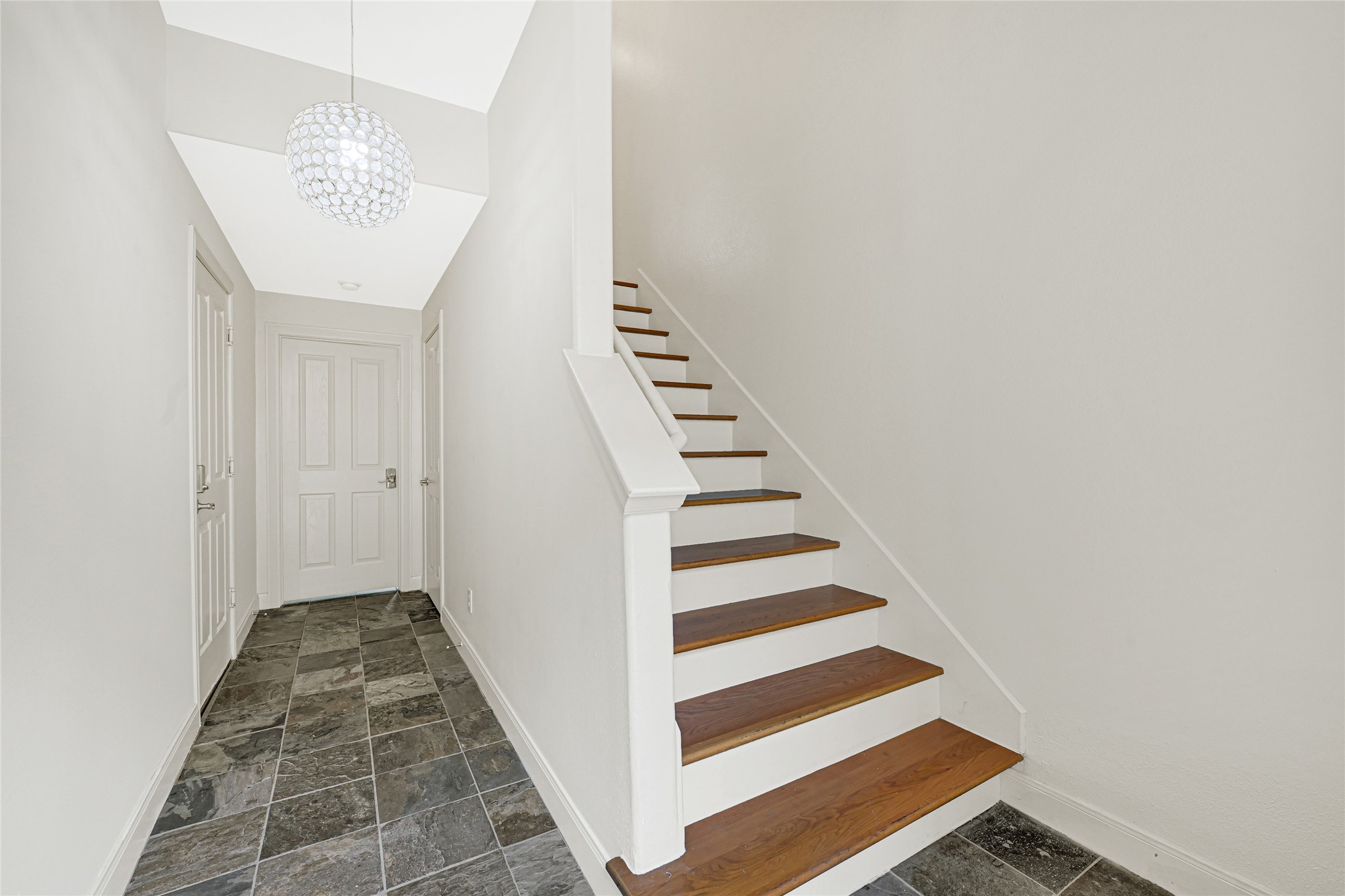 2414 Calumet Street, Unit B Houston, TX 77004 - Photo 4 of 27 a view of a hallway with wooden floor and white walls