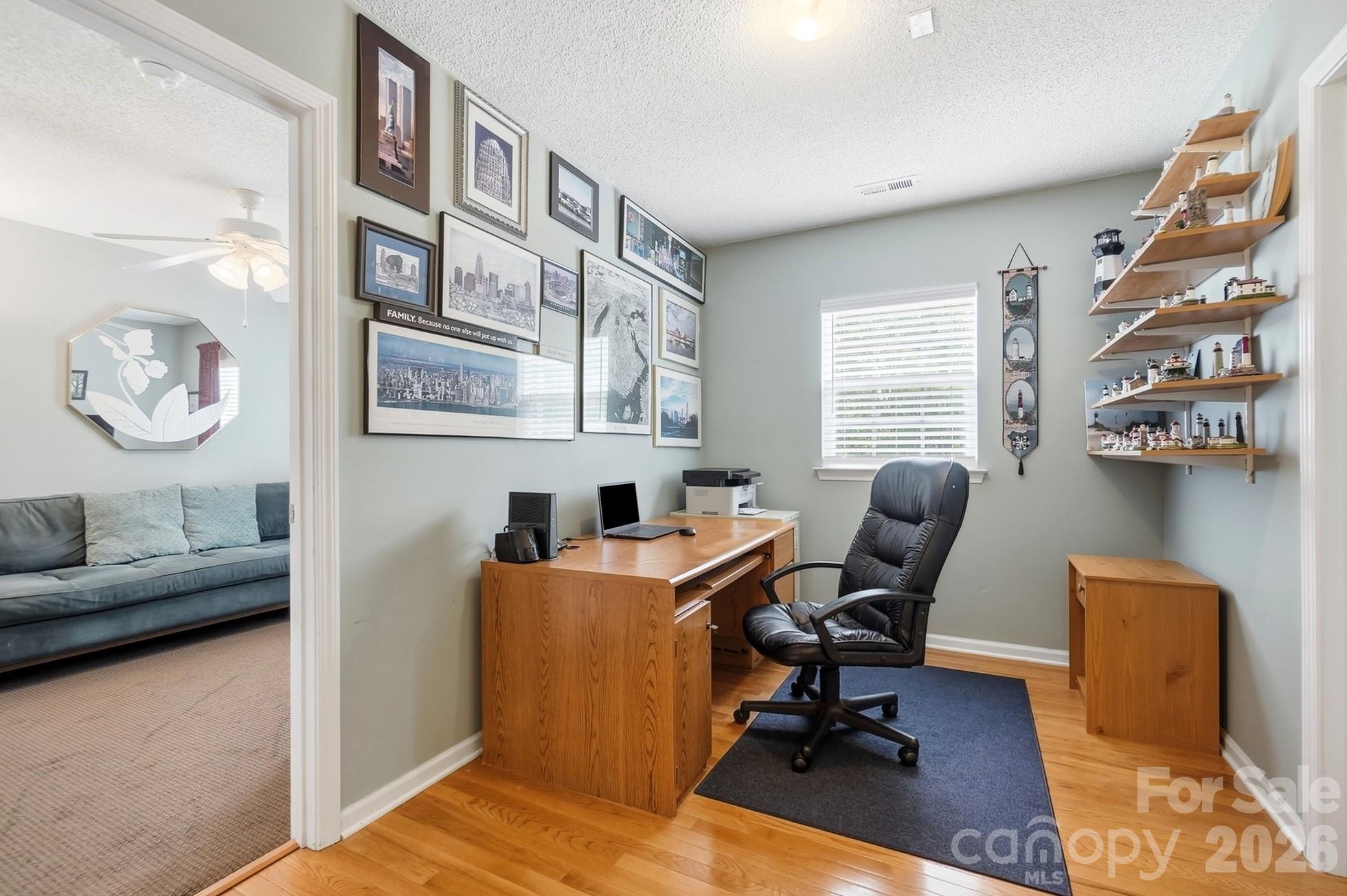442 Sugar Maple Drive Tega Cay, SC 29708 - Photo 18 of 48 a view of a workspace with furniture and a window