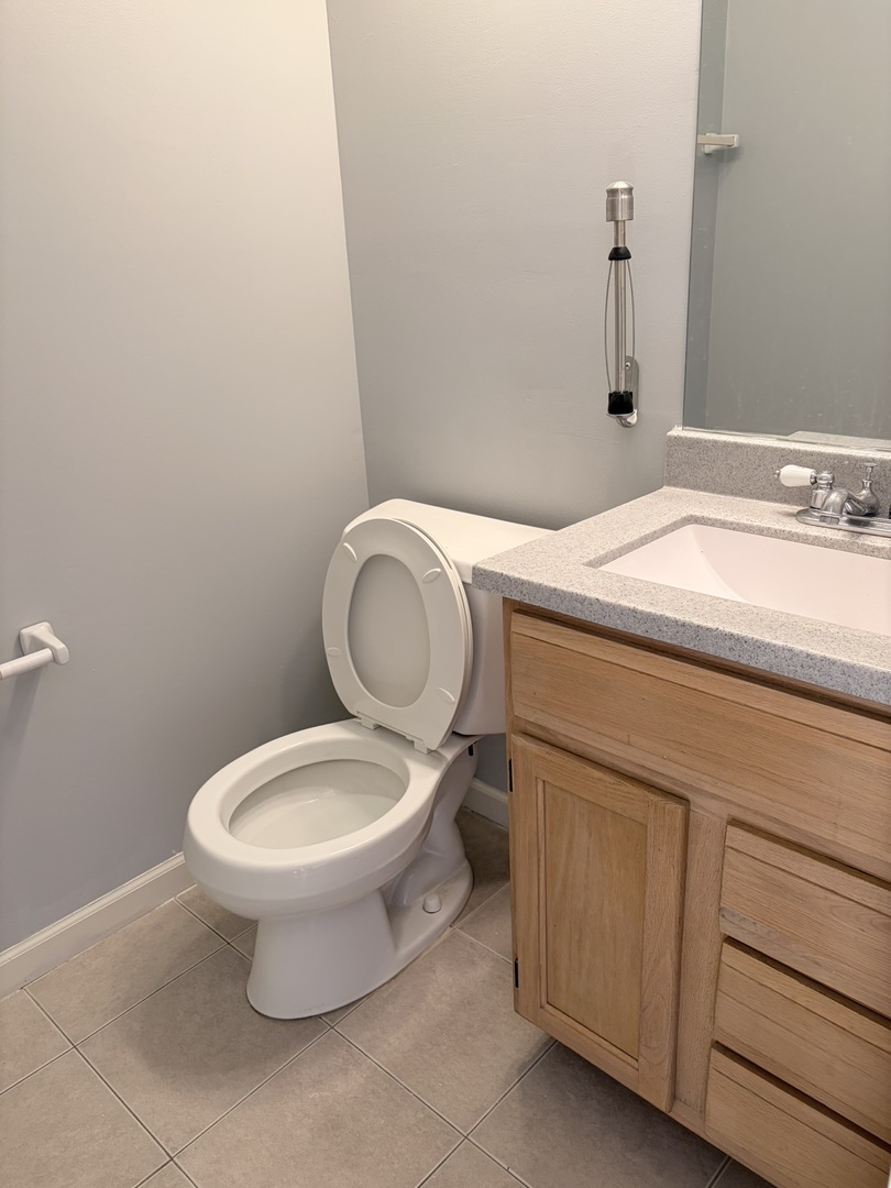 97 North Walnut Lane Schaumburg, IL 60107 - Photo 17 of 34 a bathroom with a toilet and a sink