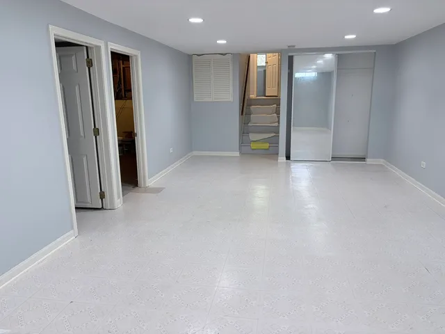 an empty room with closet area