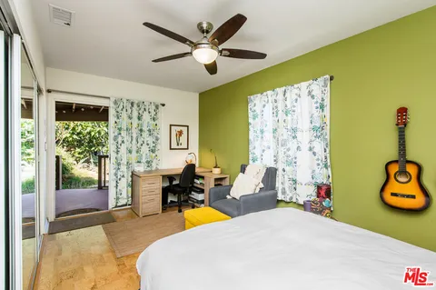 a bed room with furniture and a window