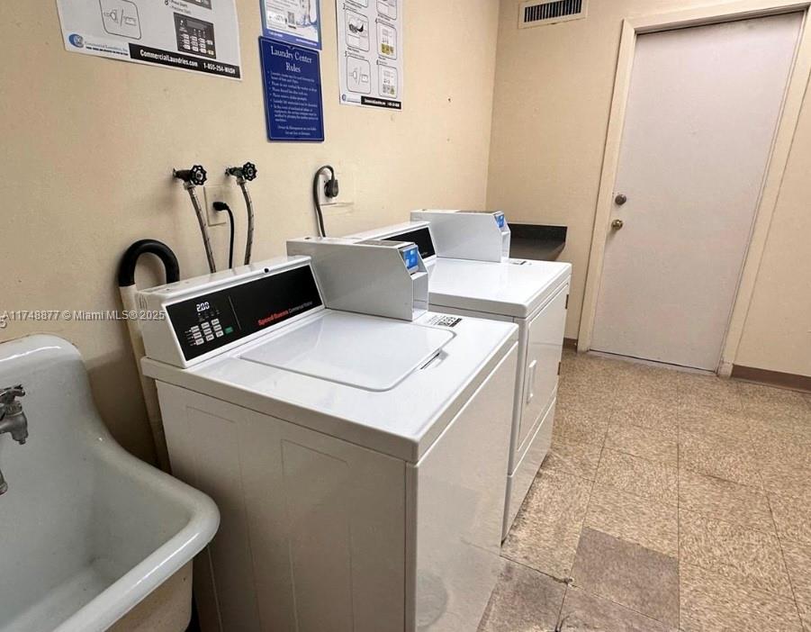 2750 Northeast 183rd Street, Unit 801 Aventura, FL 33160 - Photo 29 of 29 a utility room with dryer and washer