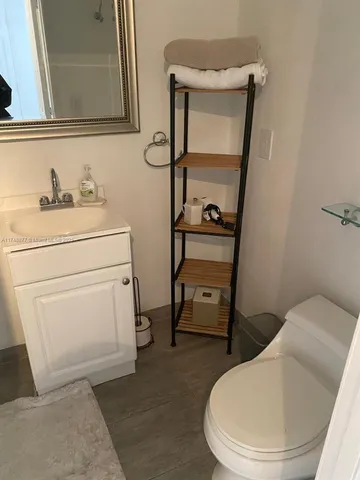 a bathroom with a toilet and a sink