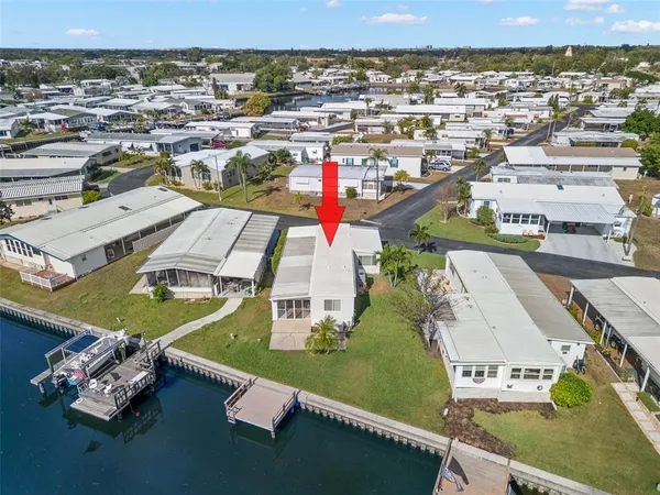 an aerial view of a house with a ocean view
