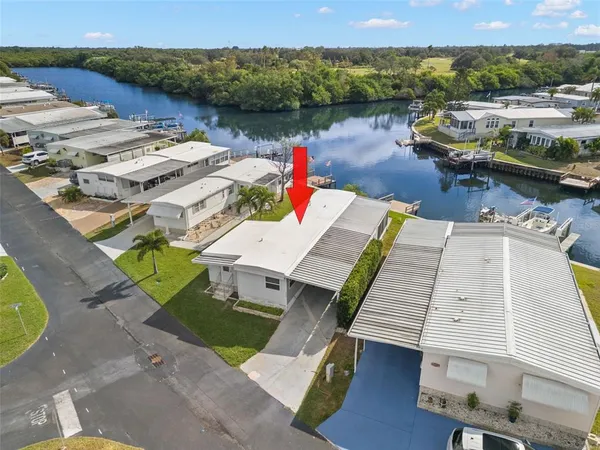 an aerial view of a house with outdoor space