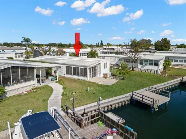 a view of a house with backyard porch and patio