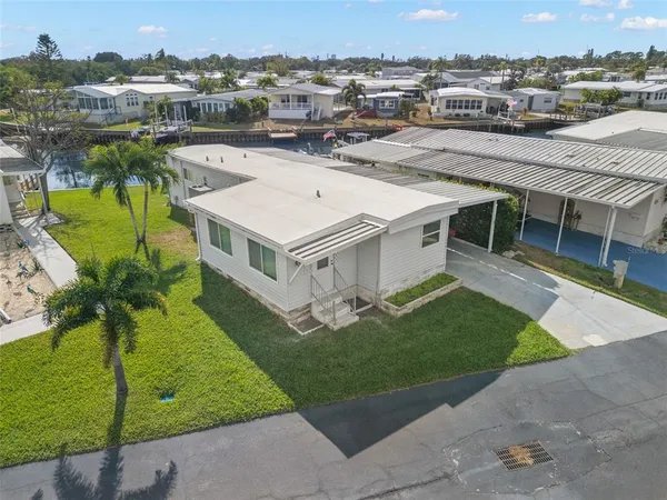an aerial view of a house with a garden and plants
