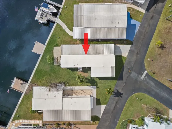 an aerial view of a house with a swimming pool
