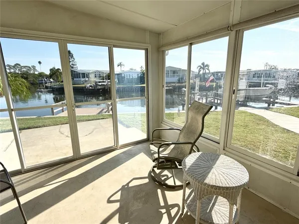 a view of a living room and floor to ceiling window