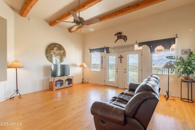 a view of a livingroom with furniture and a chandelier