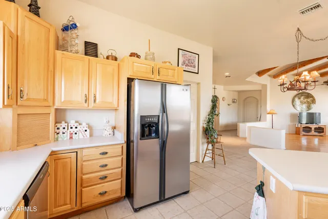 a room with a bed and a chandelier