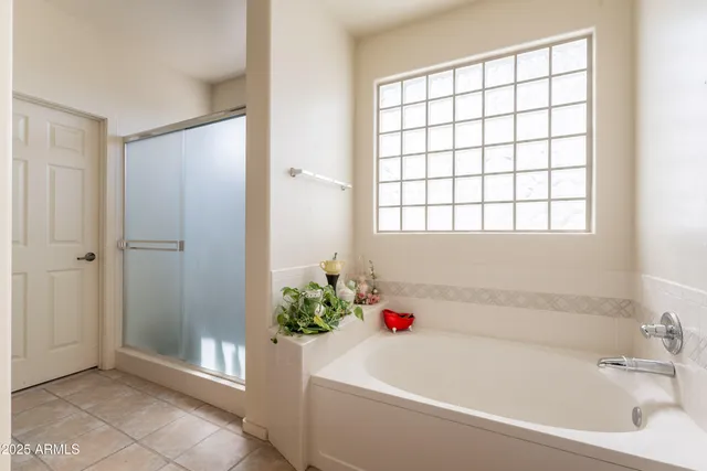 a bathroom with a granite countertop toilet a sink and mirror