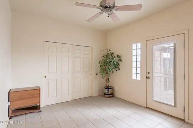 a view of a hallway with a cabinet and a bathroom