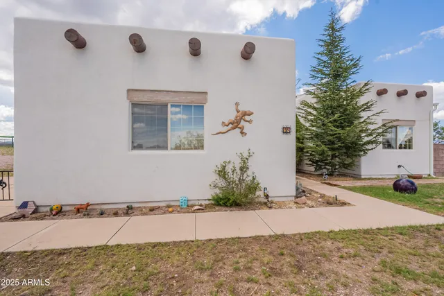 a view of a backyard of the house