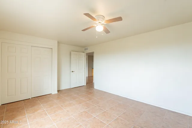 a wooden bench sitting in middle of a backyard