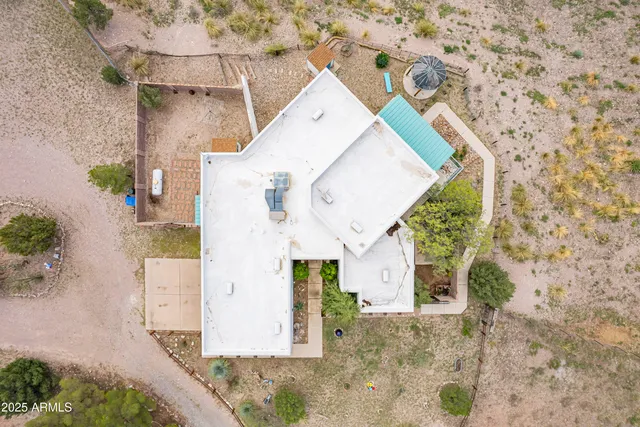 a view of house with swimming pool and furniture