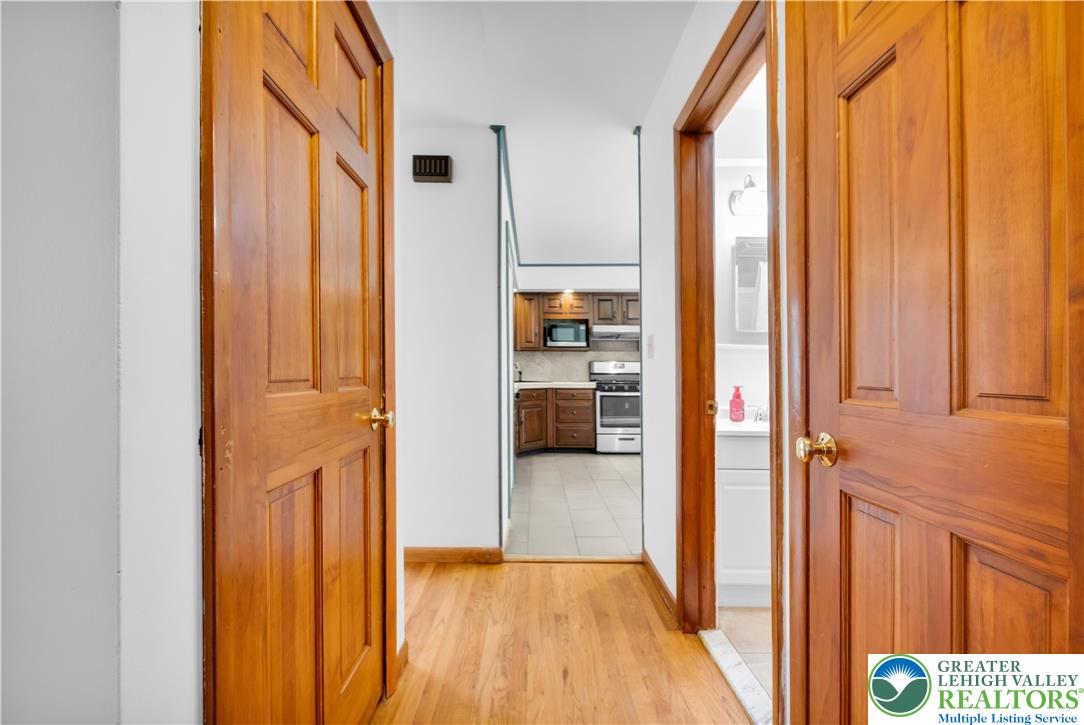 2118 6th Street Bethlehem, PA 18020 - Photo 11 of 40 a view of a hallway with wooden floor and staircase