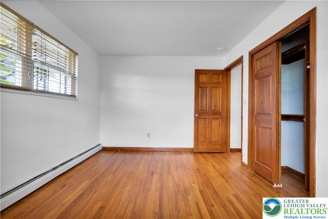 2118 6th Street Bethlehem, PA 18020 - Photo 14 of 40 an empty room with wooden floor and a window
