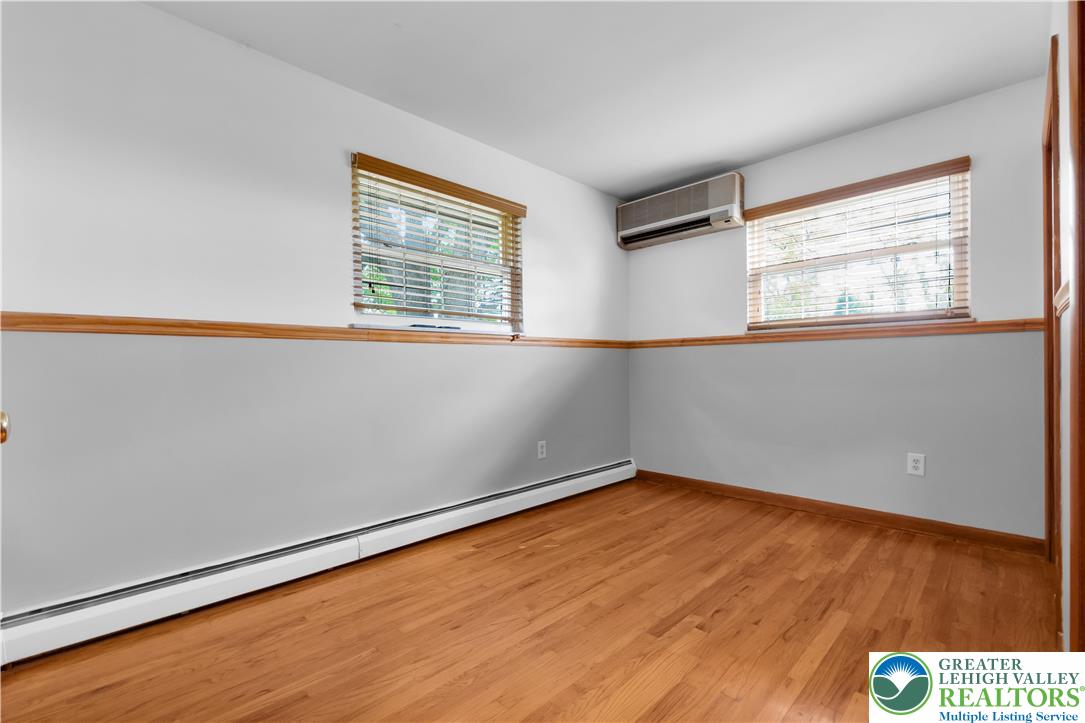 2118 6th Street Bethlehem, PA 18020 - Photo 16 of 40 a view of an empty room with wooden floor and a window