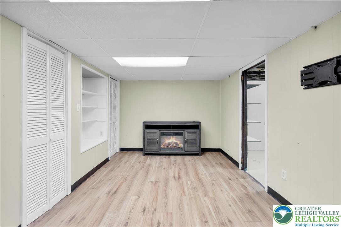 2118 6th Street Bethlehem, PA 18020 - Photo 28 of 40 a view of a livingroom with wooden floor and a fireplace