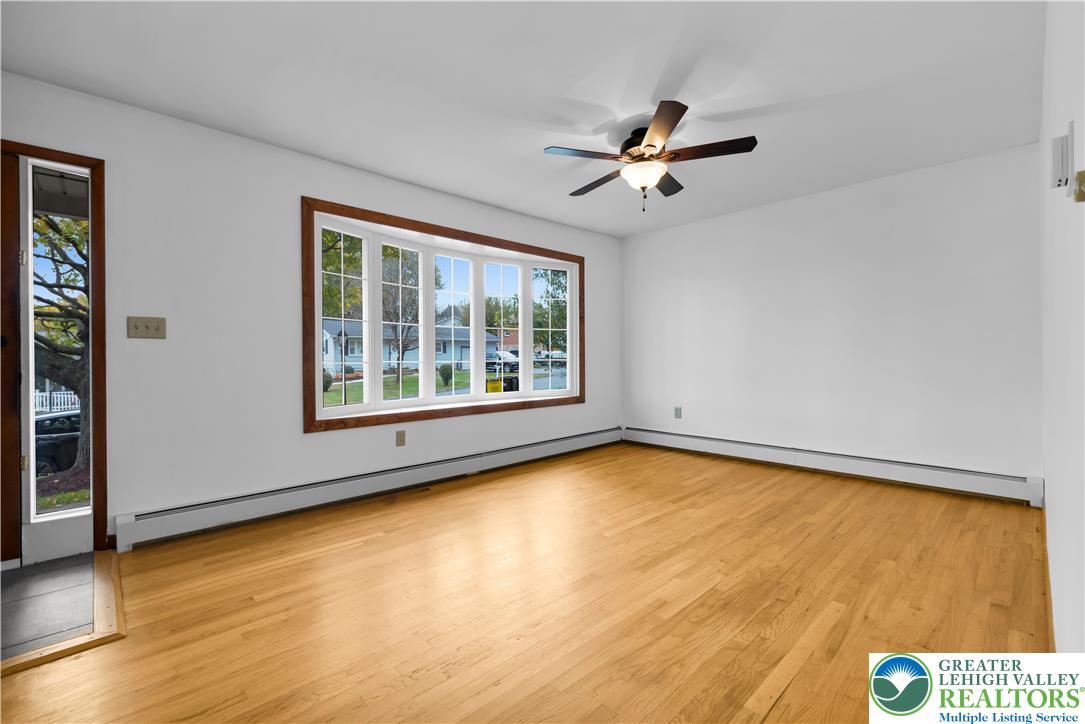2118 6th Street Bethlehem, PA 18020 - Photo 3 of 40 a view of an empty room with a window and wooden floor