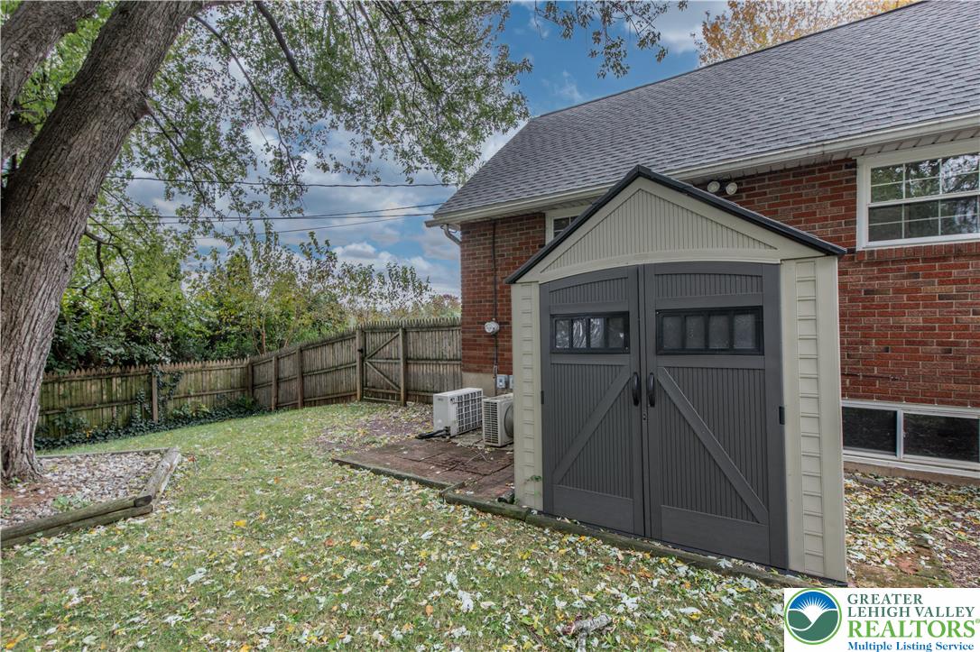 2118 6th Street Bethlehem, PA 18020 - Photo 36 of 40 a view of a small house with a small yard and wooden fence