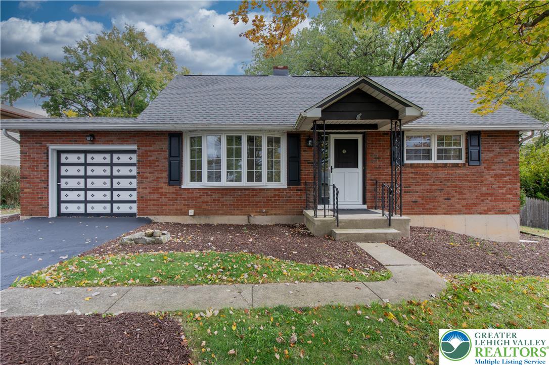 2118 6th Street Bethlehem, PA 18020 - Photo 40 of 40 a front view of a house with a yard and garage