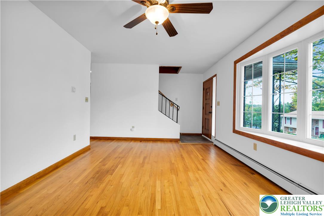 2118 6th Street Bethlehem, PA 18020 - Photo 4 of 40 a view of an empty room with wooden floor and a window