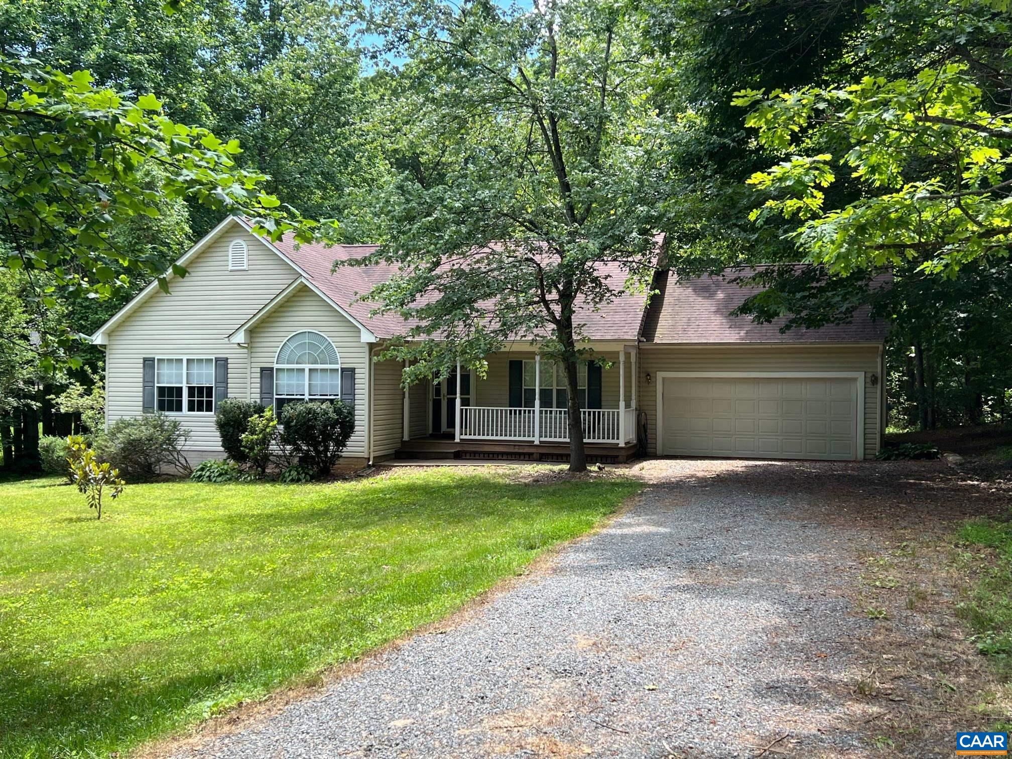 48 Northridge Road Ruckersville, VA 22968 - Photo 30 of 30 a front view of a house with a garden and trees