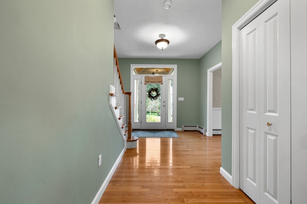 731 Samuel Drive Northbridge, MA 01588 - Photo 11 of 33 a view of a hallway with wooden floor and a window