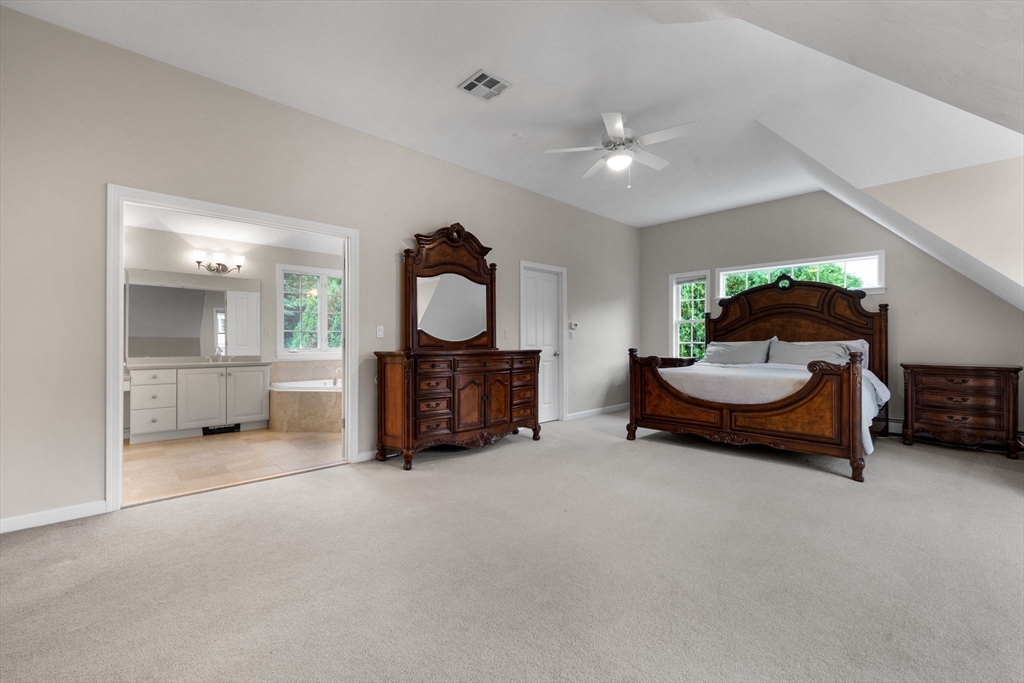 731 Samuel Drive Northbridge, MA 01588 - Photo 16 of 33 a living room with furniture and a chandelier