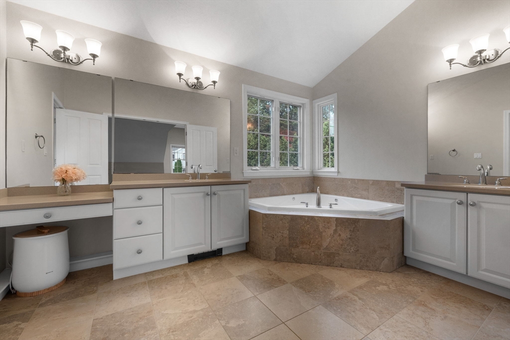731 Samuel Drive Northbridge, MA 01588 - Photo 18 of 33 a spacious bathroom with a granite countertop bathtub sink and mirror