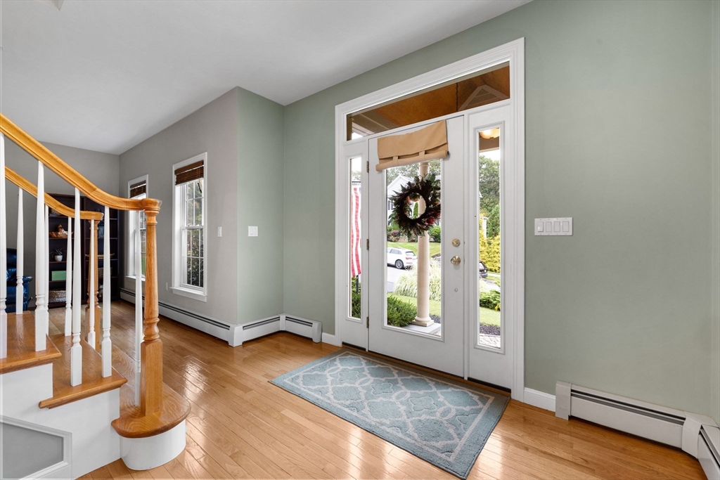 731 Samuel Drive Northbridge, MA 01588 - Photo 2 of 33 a view of an entryway with wooden floor and door