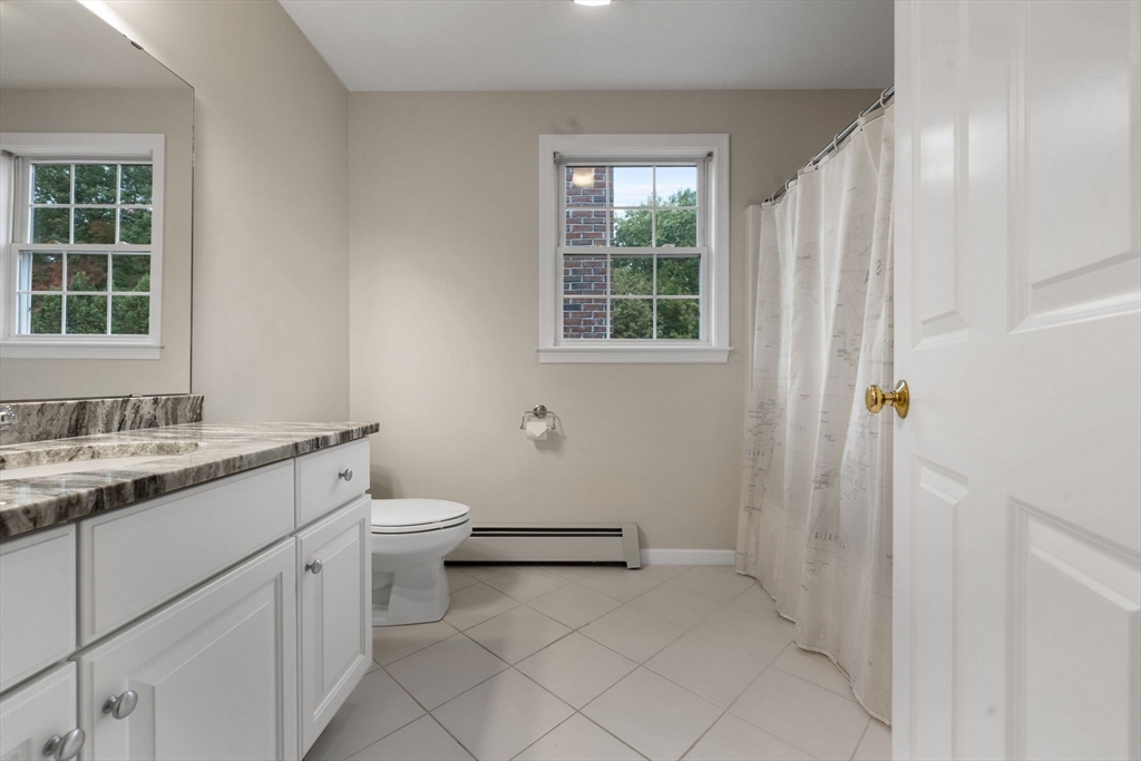 731 Samuel Drive Northbridge, MA 01588 - Photo 23 of 33 a bathroom with a granite countertop sink toilet and shower
