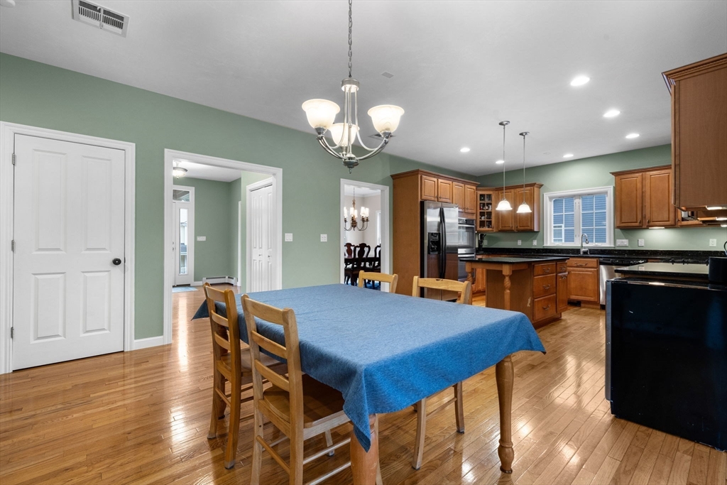 731 Samuel Drive Northbridge, MA 01588 - Photo 5 of 33 a view of a dining room with furniture and wooden floor