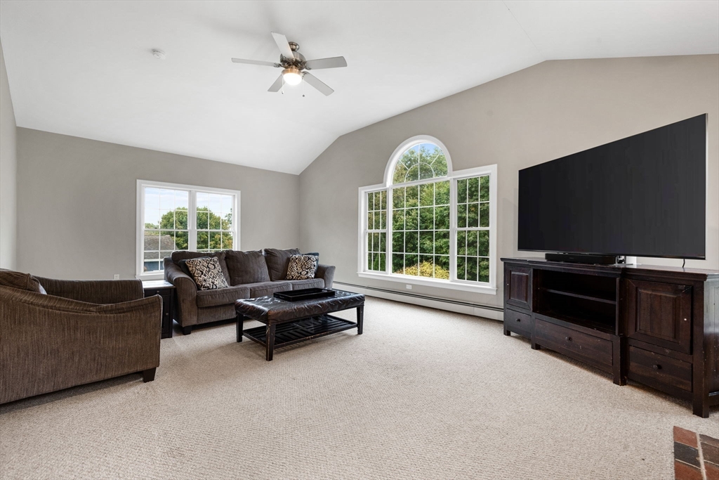 731 Samuel Drive Northbridge, MA 01588 - Photo 8 of 33 a living room with furniture and a flat screen tv