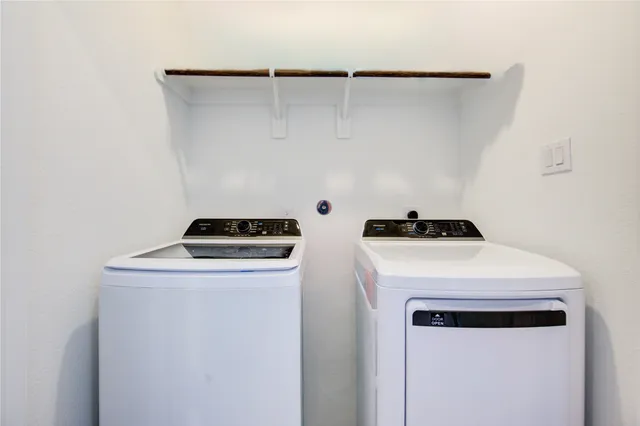 a bedroom with a bed and a table