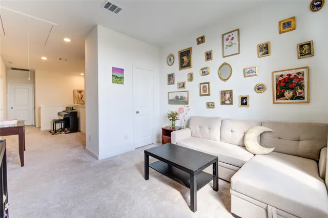 a kitchen with stainless steel appliances granite countertop a sink and chairs