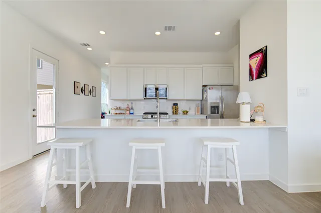a bathroom with a sink toilet and a mirror