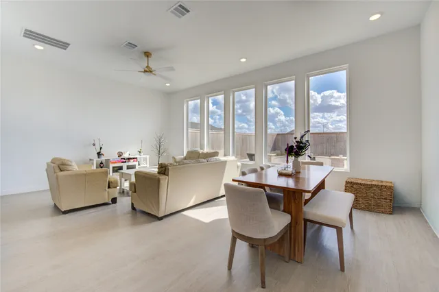 a view of a garden with chairs