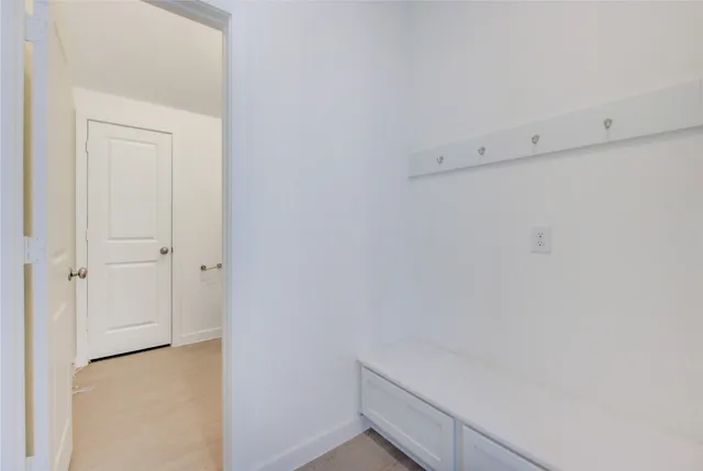 a view of a chairs in backyard of the house