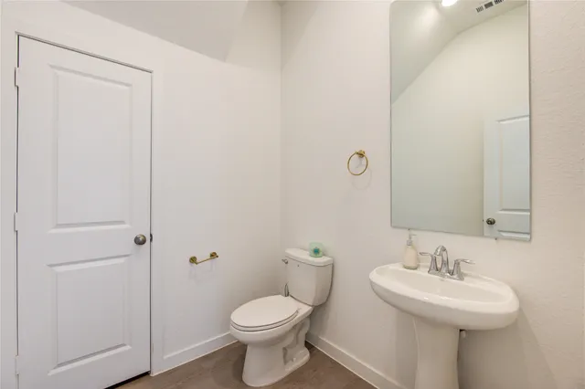 a backyard of a house with a garden and outdoor seating