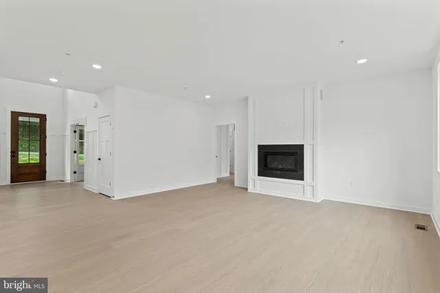 a kitchen with stainless steel appliances a stove refrigerator sink and cabinets