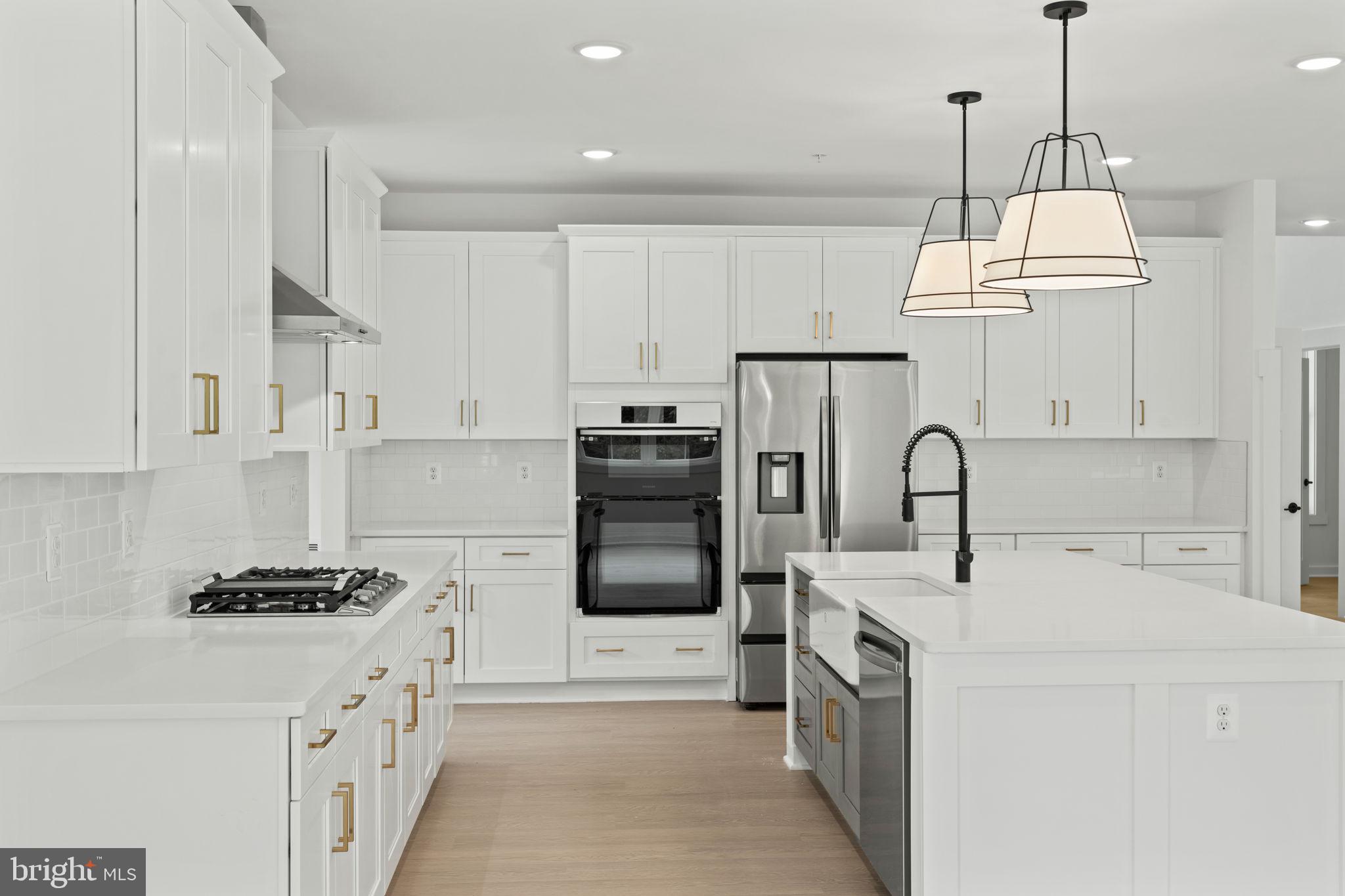 640 Grim Road Stephens City, VA 22655 - Photo 12 of 50 a kitchen with stainless steel appliances a stove refrigerator sink and cabinets