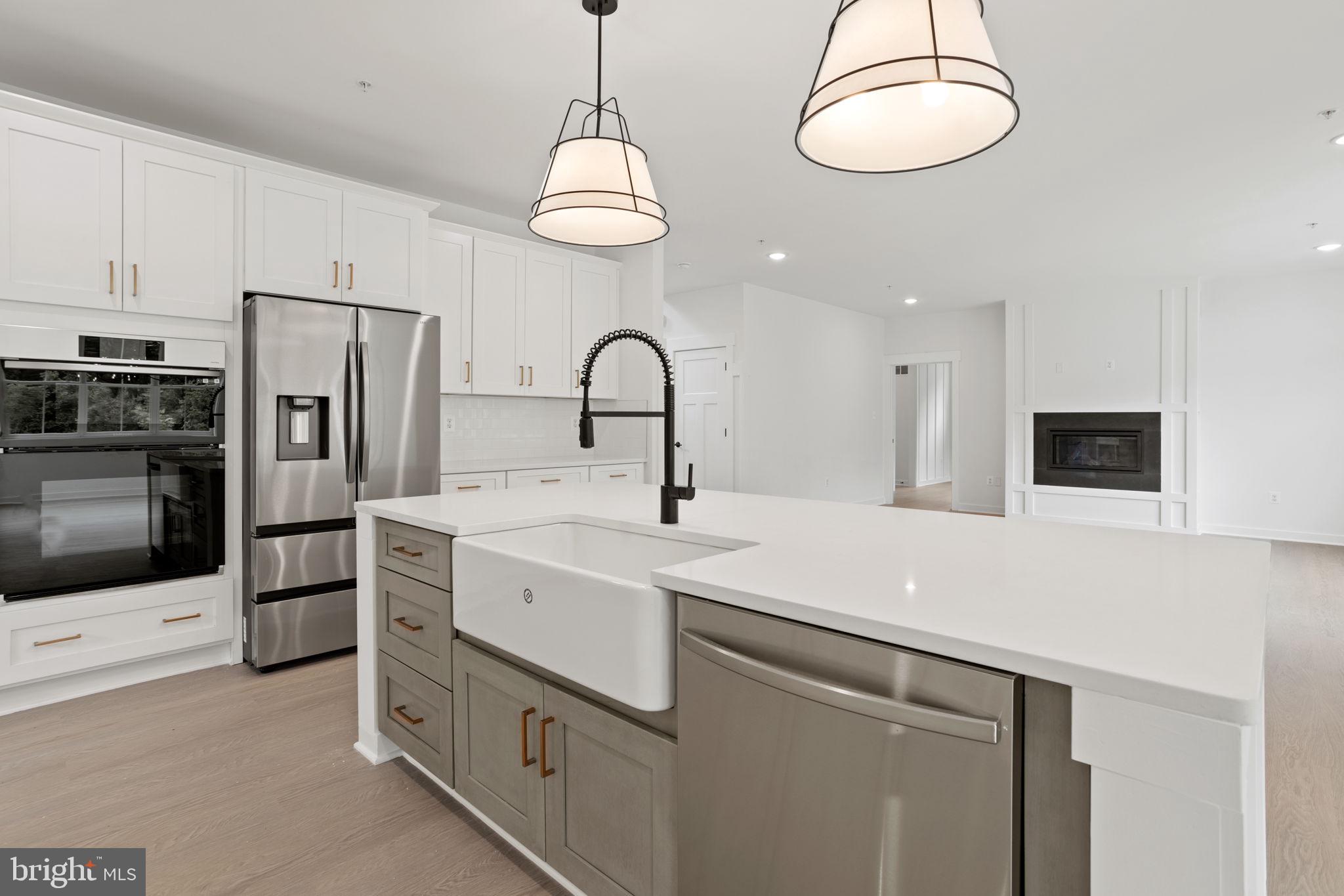 640 Grim Road Stephens City, VA 22655 - Photo 17 of 50 a kitchen with stainless steel appliances a refrigerator sink and microwave