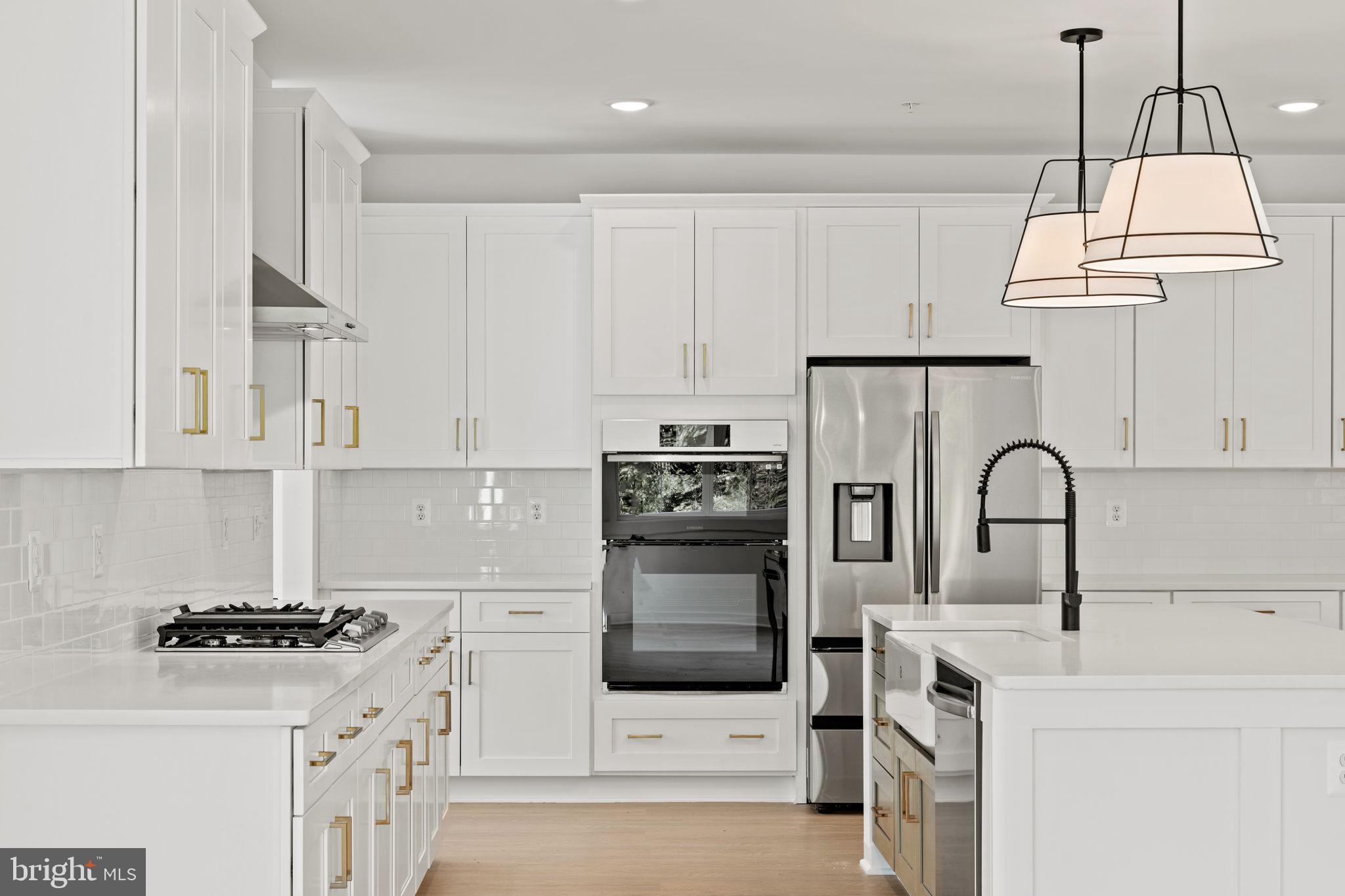 640 Grim Road Stephens City, VA 22655 - Photo 18 of 50 a kitchen with stainless steel appliances granite countertop a stove a sink dishwasher and a refrigerator