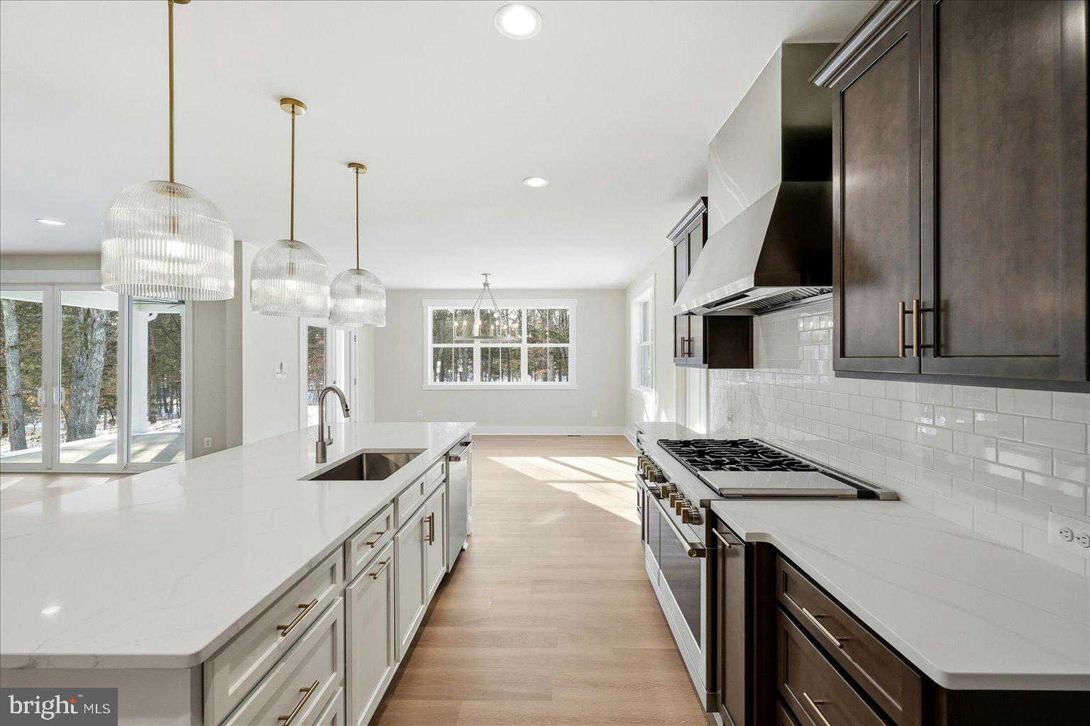 640 Grim Road Stephens City, VA 22655 - Photo 19 of 50 a kitchen with stainless steel appliances kitchen island a large counter tops and a view of living room